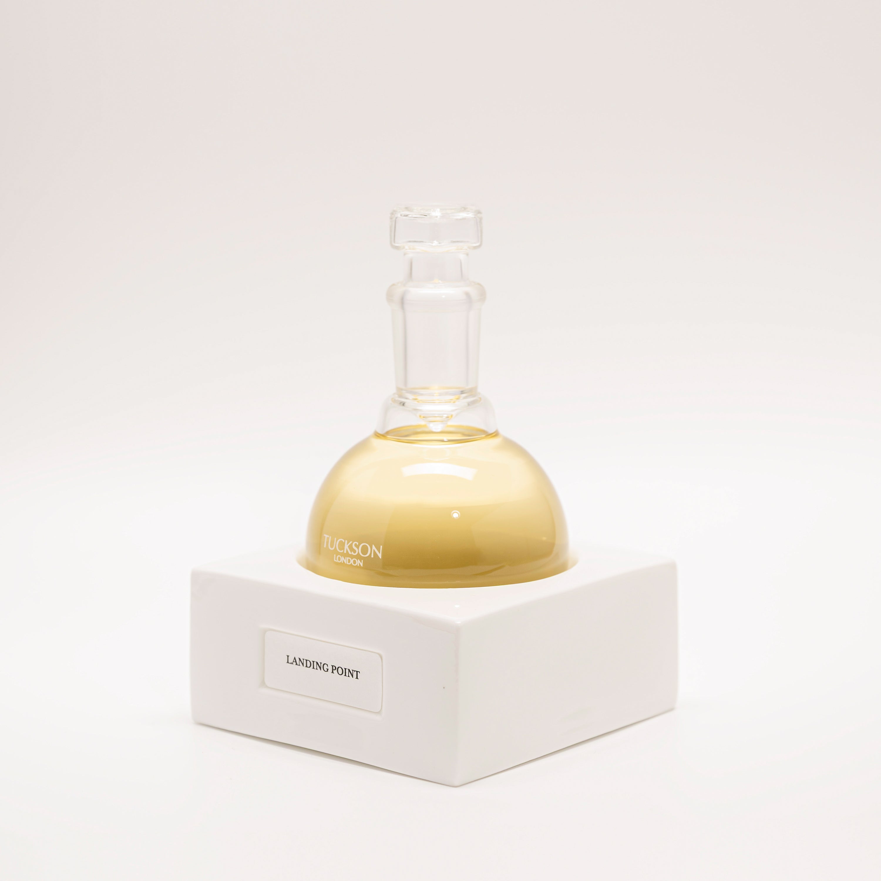 Tuckson Flagship Landing Point Eau de Parfum flask on hand made porcelain base 
