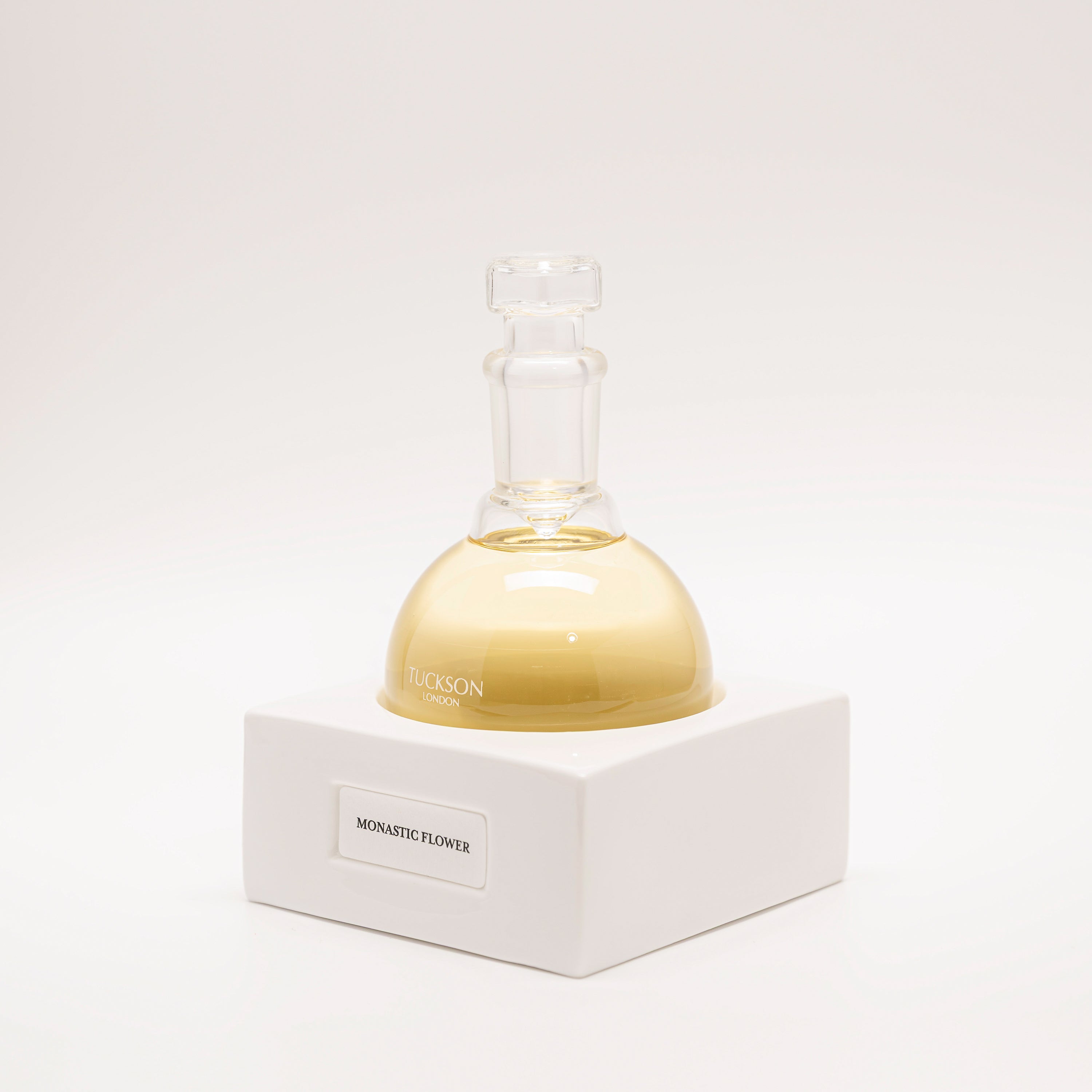Tuckson Flagship Monastic Flower Eau de Parfum flask on hand made porcelain base 

