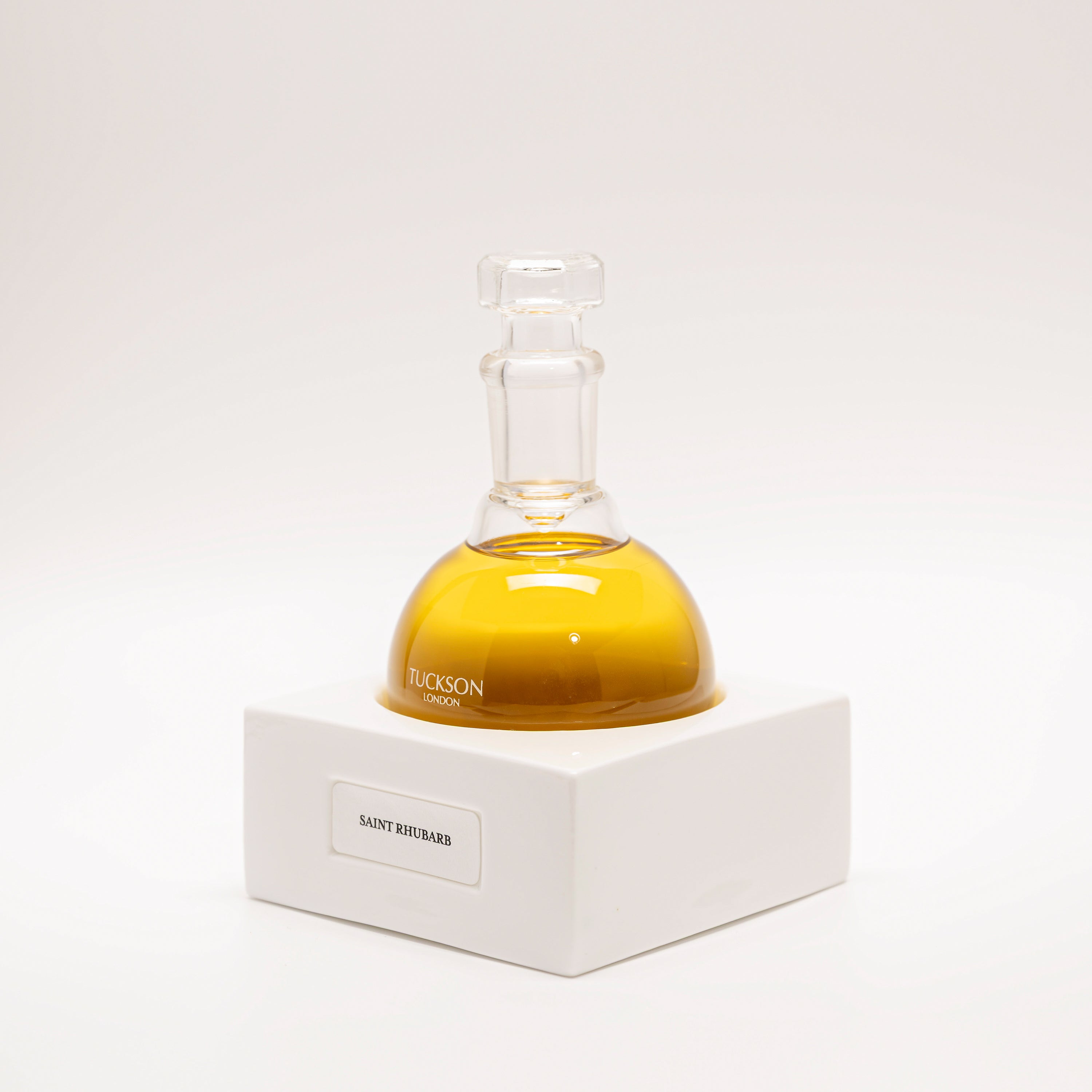 Tuckson Flagship Saint Rhubarb Eau de Parfum Solar Flair flask on hand made porcelain base 
