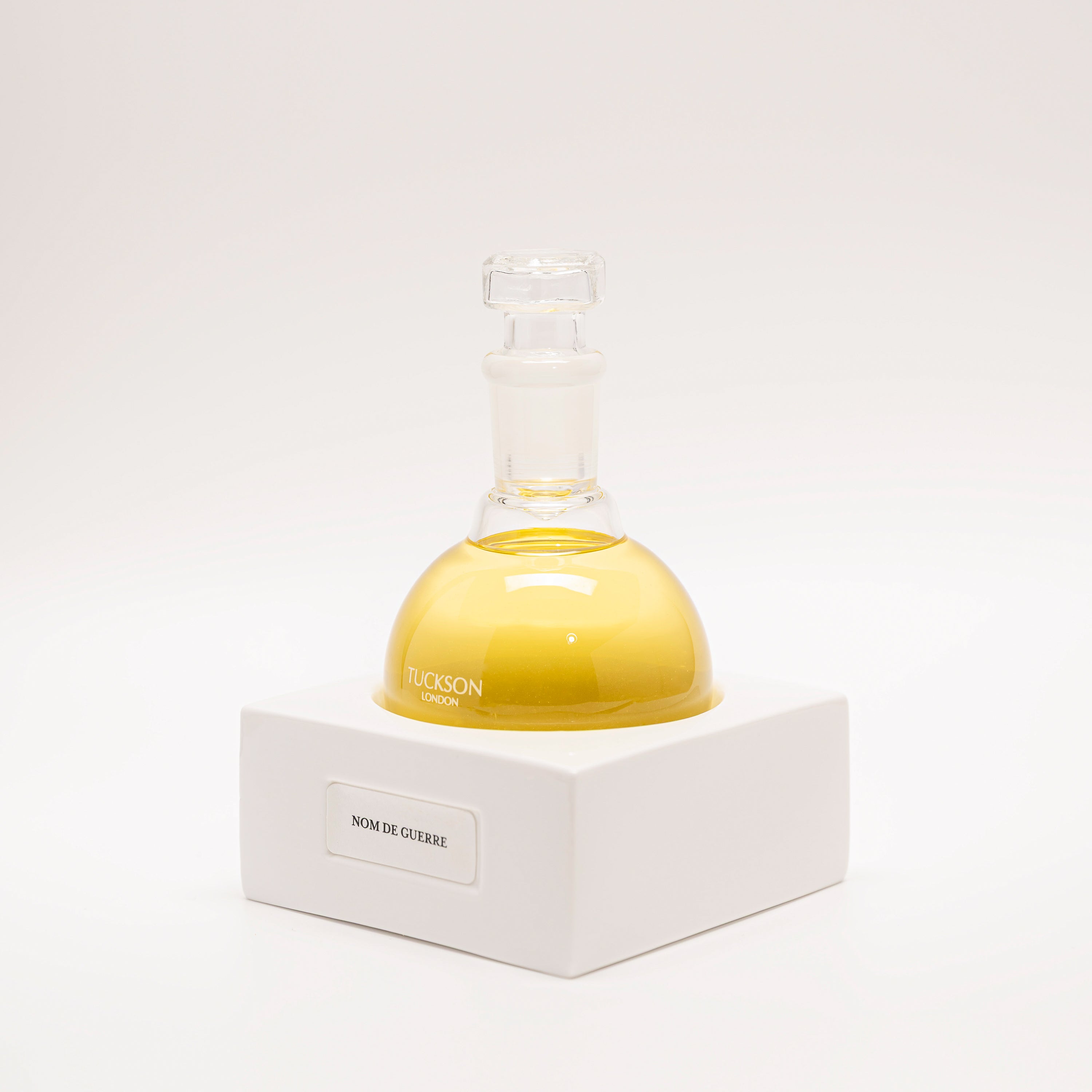 Tuckson Flagship Nom de Guerre Eau de Parfum flask on hand made porcelain base 