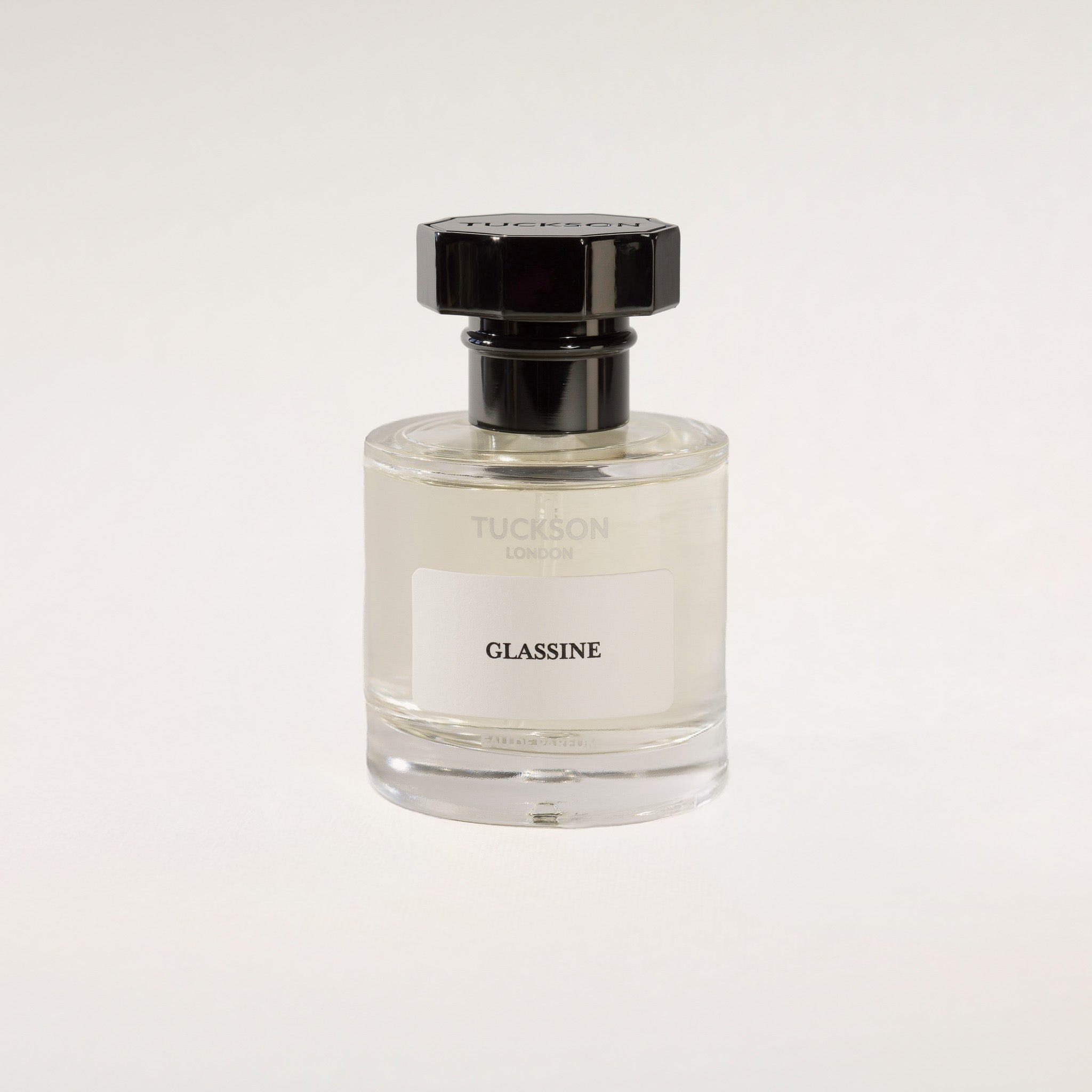 TUCKSON london Glassine Eau de Parfum 50 ml Atomiser with black metal overcap from the front angle 