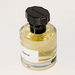 TUCKSON london Psidium Eau de Parfum 50 ml Atomiser with black metal overcap from the top angle
