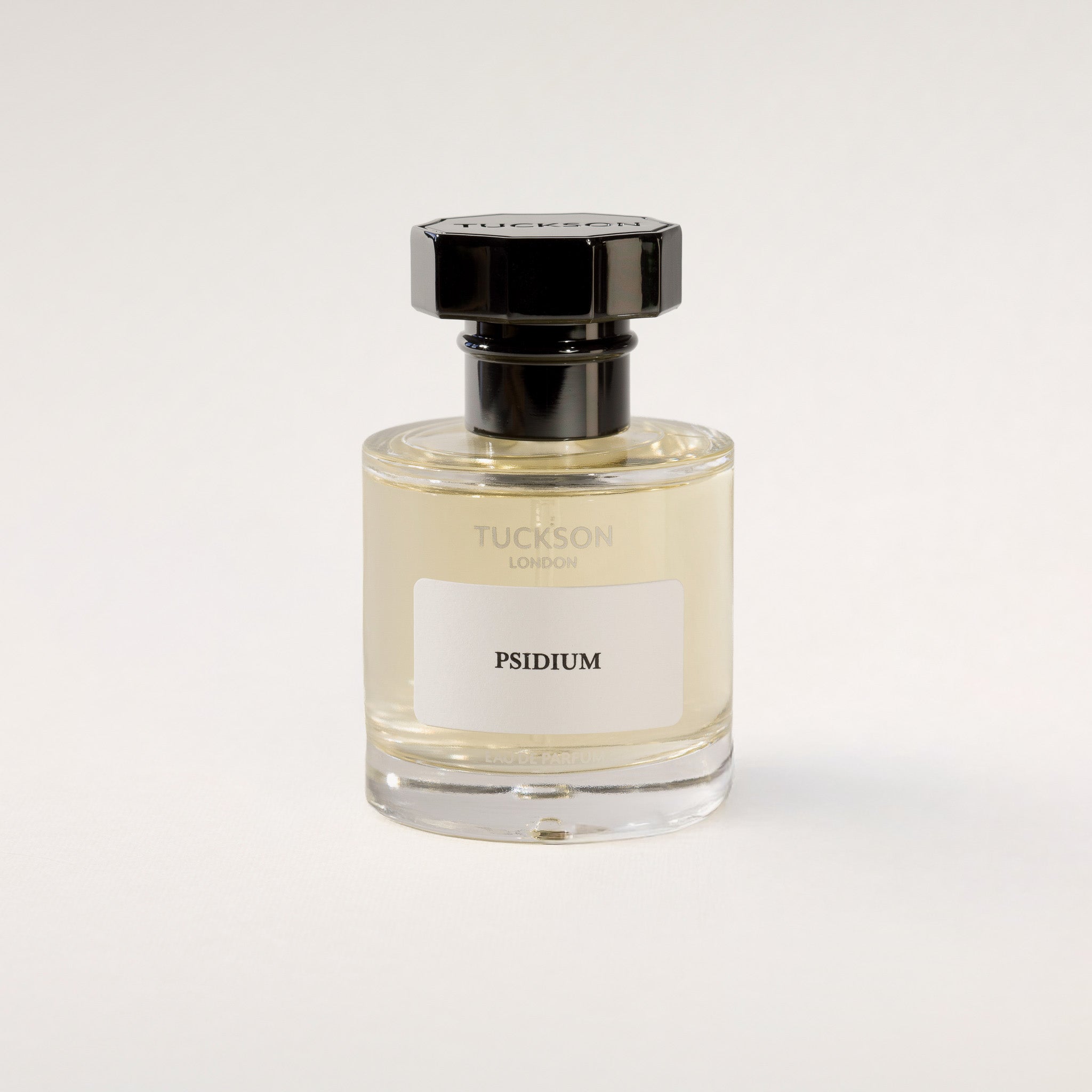 TUCKSON london Psidium Eau de Parfum 50 ml Atomiser with black metal overcap from the front angle 