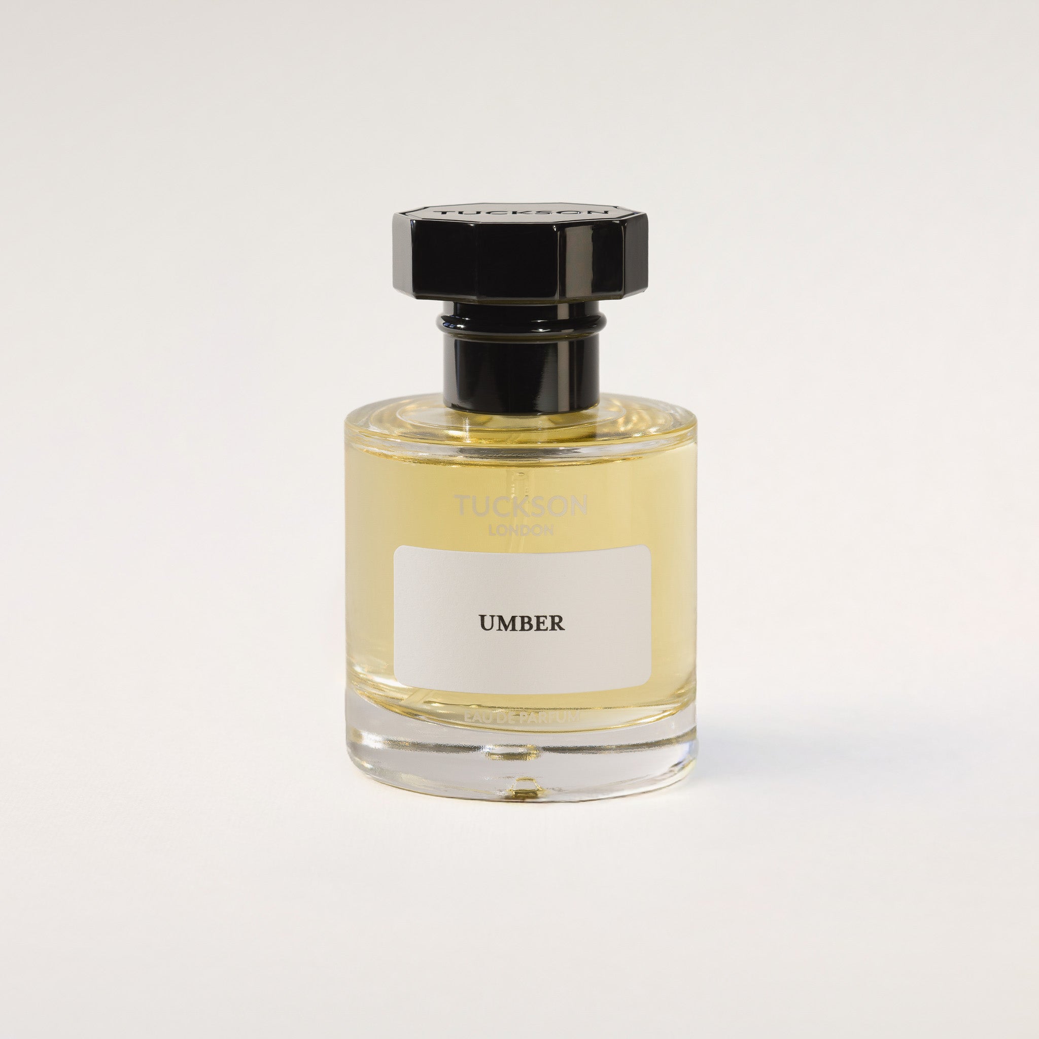 TUCKSON london UMBER Eau de Parfum 50 ml Atomiser with black metal overcap from the front angle 

