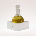 TUCKSON london Umber Eau de Parfum 150 ml  flagship flask resting on a handmade white porcelain square base labelled UMBER